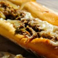 Philly Cheesesteak · Ground Thinly Sliced Beef Steak w/ Bell Peppers & Onions and your choice of melted cheese.