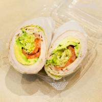 Simply’s Wrap · Oven Gold Turkey, Swiss Cheese, Avocado, Lettuce, Tomatoes & Ranch Dressing.