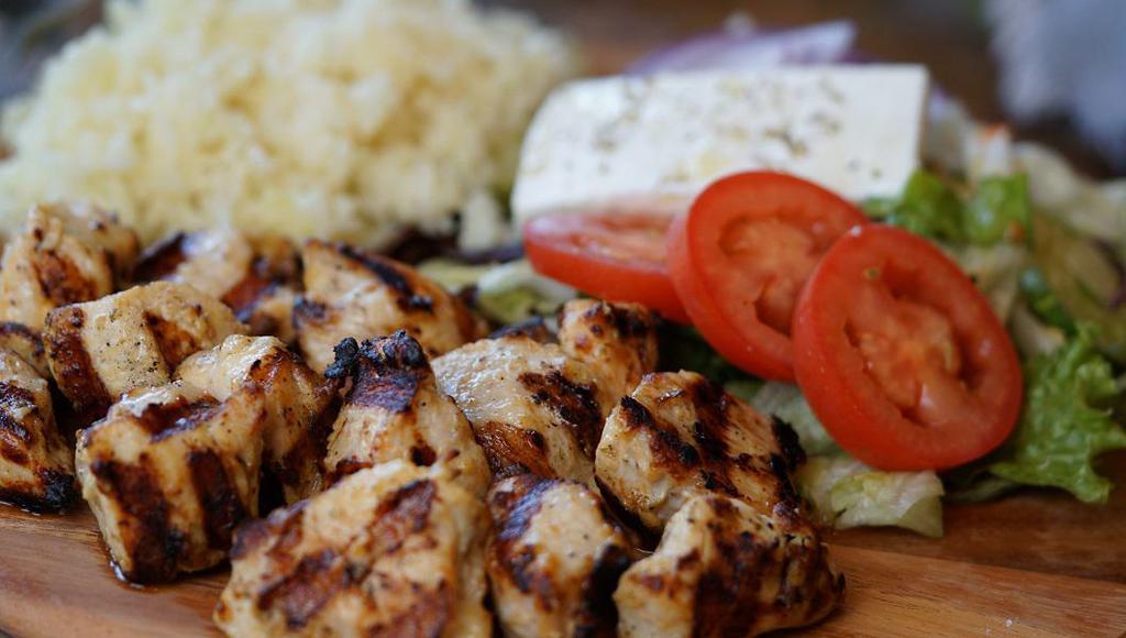 Chicken Souvlaki Platter · Served with salad, pita bread and tzatziki sauce and choice of side.