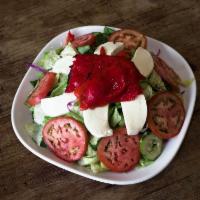 Italian Salad · Mixed greens, tomatoes, cucumbers, fresh mozzarella and roasted peppers.