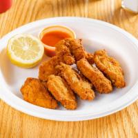 7 Piece Buffalo Wings · Served with a choice of a sauce. Mild spicy, breaded and deep fried.