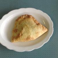 Beef with Cheese Empanada · Beef, cheese and spices.