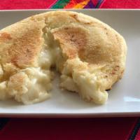 Cheese Arepa · A round cornmeal patty stuffed with cheese