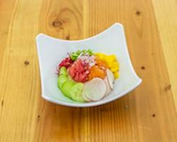 Fusion Bowl · Cubed salmon, tuna, avocado, red onions, tomatoes on a bed of steamed rice.