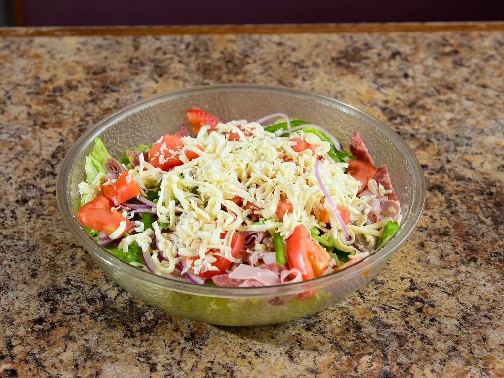 Small Antipasto Salad. Serves 2-3 · Lettuce, onion, green pepper, tomato, cheese, ham and salami. Comes with a 2 oz and a 4 oz cup of dressing