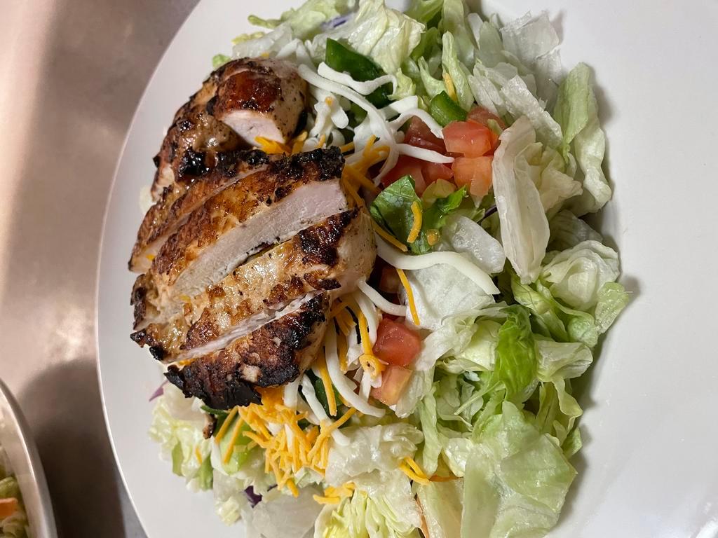 Grilled Chicken Salad · Grilled chicken breast over mixed greens with provolone and cheddar cheese, onion, green peppers and tomatoes. Make it fried chicken. 