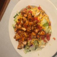 BuffaloGrilled Chicken Salad · Mixed greens with Buffalo grilled chicken, cheddar cheese and diced tomatoes. Make it fried ...