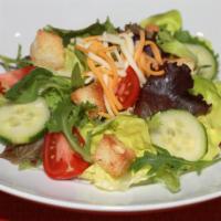 House Salad · Organic mixed greens, cucumber, vine-ripened tomatoes, cheese, and ciabatta croutons. Choice...