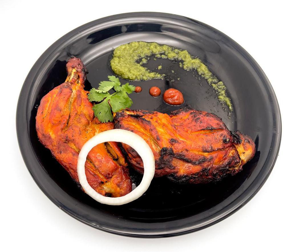 Chicken Tandoori · Spring chicken marinated in mild spices and BBQ. With basmati rice. 2 pieces.
