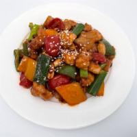 Chicken Kung Pao · Chicken, peanuts and vegetables, finished with chili peppers.