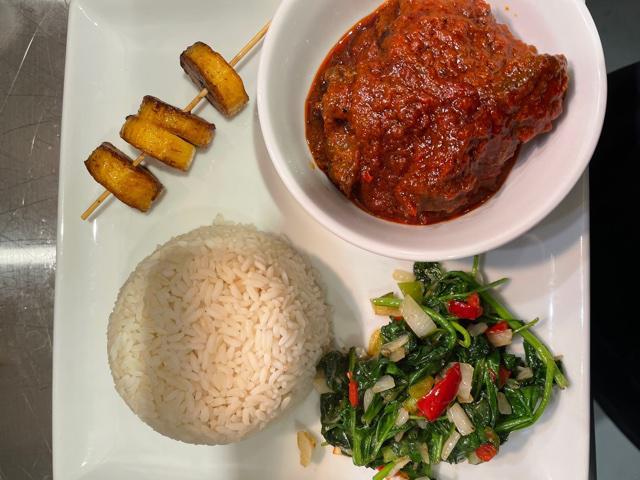 Stew and Rice · Flavorful tomato stew served with choice of protein- beef, chicken, goat. Served with steamed white rice, fried plantain and spinach.