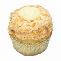 Banana Cream Pie Cupcake · Vanilla cupcake filled with banana filling. Topped with light, fluffy frosting, and rolled i...