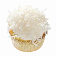 Coconut Snowball Cupcake · Vanilla cupcake topped with vanilla buttercream and rolled in flaky coconut.