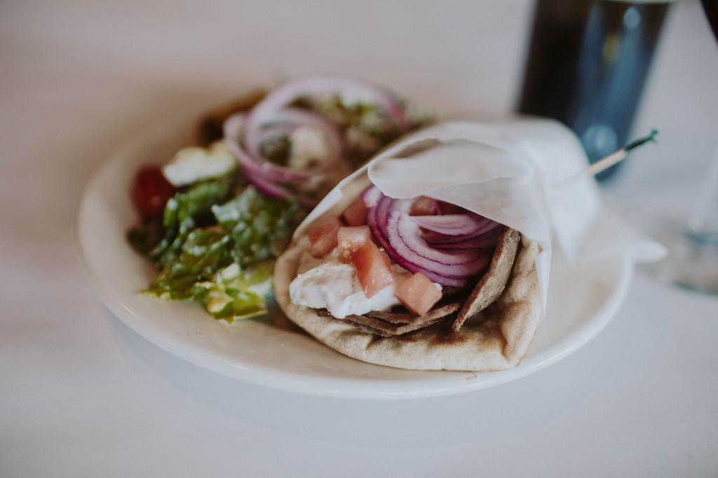 Gyro · Lamb and beef, tomato, onion, tzatziki and served with homemade fries.