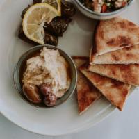 Vegetarian Greek Platter · Dolmas, tabouli, spanakopita, hummus, feta, olives, toasted pita 
