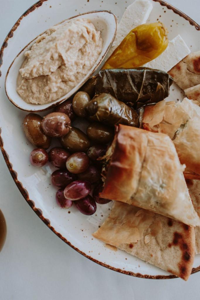 Greek Appetizers Plate · Assorted olives, feta cheese, spanakopita, dolmathes, hummus,  & toasted pita.