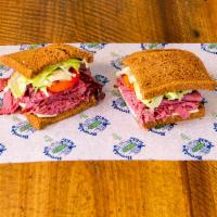 Brooklyn Pickle Special Sandwich · Comes with corned beef, pastrami, Russian dressing and Swiss Cheese on dark rye bread.