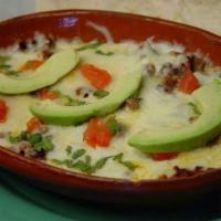 Choriqueso · Special cheese melted with chorizo Mexican sausage and grilled onions, served with warm tort...