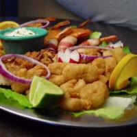 Super Botana de Mariscos · Seafood mix with breaded calamari rings, grilled shrimp, bacon wrapped shrimp, stuffed crabs...