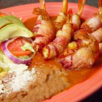 Camarones Sinaloa · Cheese stuffed and wrapped in bacon shrimp, deep fried and served over spicy chipotle sauce ...