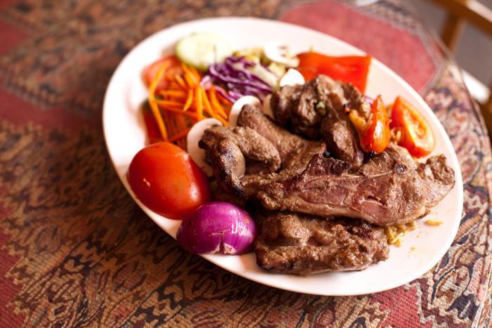 Lamb Steak · Lamb steak marinated and grilled. Served with rice, salad and Afghani bread. 