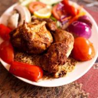 Tandoori Chicken Kebab · Chunks of boneless chicken breast flavored with tandoori masala. Served with rice, salad and...