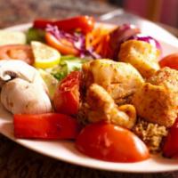 Spicy Fish Kebab · Chunks of basa fish marinated in fresh spices and grilled. Served with rice, salad and Afgha...