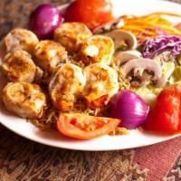 Shrimp Kebab · Jumbo shrimp marinated in fresh herbs and spices, then grilled. Served with rice, salad and ...