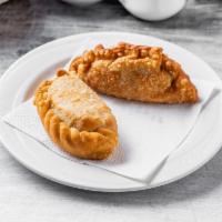 Empanada · Gaucho pie. Stuffed pie with your choice of meat, chicken or spinach deep-fried.