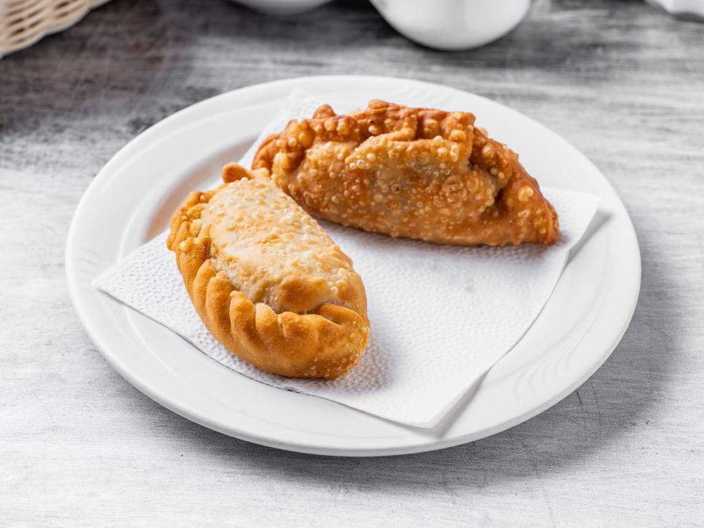 Empanada · Gaucho pie. Stuffed pie with your choice of meat, chicken or spinach deep-fried.