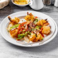 Camarones a la Parrilla · Grilled shrimp. Grilled jumbo shrimp wrapped in bacon and served with sauteed peppers and on...