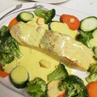 Salmon Mostaza · Mustard salmon. Salmon steak grilled and sauteed in creamy mustard sauce served over asparag...