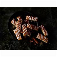 Cinnamon Stix · 12 pieces. Freshly baked Detroit-Style deep dish dough with butter, cinnamon sugar and toppe...