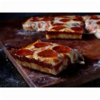 Jet's Detroit-Style Deep Dish Pepperoni Slice · Comes with premium mozzarella and pepperoni.