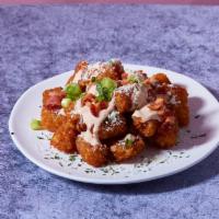 Bacon Truffle Tots · Tater tots with zesty truffle aioli, bacon crumble, and chives