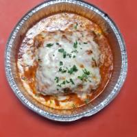 Baked Lasagna · Freshly made lasagna layers with stuffed chopped meat melted together with mozzarella cheese...