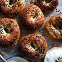 Assorted bagels with butter or cream cheese · Plain, onion, Cinnamon raisin, Onion, whole wheat, Egg or everything