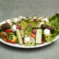Greek Salad · Greens, tomato, feta cheese, anchovies, onion and olives.