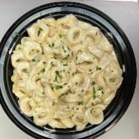 Cheese Tortellini Alfredo · Served with soup of the day or house salad. 
