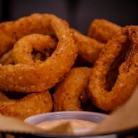 Onion Rings · Served with zesty onion ring sauce.