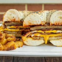 King Sandwich · Bacon, pork roll, sausage, cheese, 2 eggs and home fries.