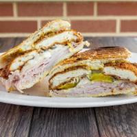 Cuban Panini · Ham, chicken cutlet, Swiss cheese, pickles, mustard and mayo.