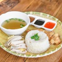 Thai Chicken Rice · Kao mun gai. Flavored jasmine rice served with fried or steamed chicken served with side soup.