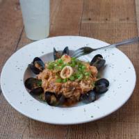 Jambalaya · shrimp, andouille sausage, mussels, calamari, tomatoes, onions, garlic and rice.