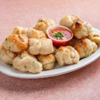 Garlic Knots · Rolled baked garlic bread. 