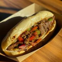 Philly · Your choice of beef or chicken, peppers and onions all cooked together and stuffed in a bagu...