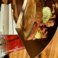 The Sandwich · Fried buttermilk marinated chicken breast fried, topped with hot honey, pickles, house mayo ...