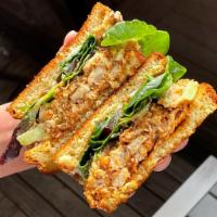 Fried Chicken Salad Sammie · Buttermilk fried chicken salad, lettuce, tomato, and onion on thick sliced toasted brioche. 