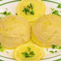 Hummus · Homemade. Chickpeas mashing into a paste with lemon juice and flavored with tahini. Served w...
