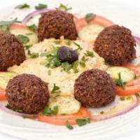 Falafel with Hummus · 5 pieces. vegetarian falafel chickpeas mashed with onions, parsley and garlic and deep fried.